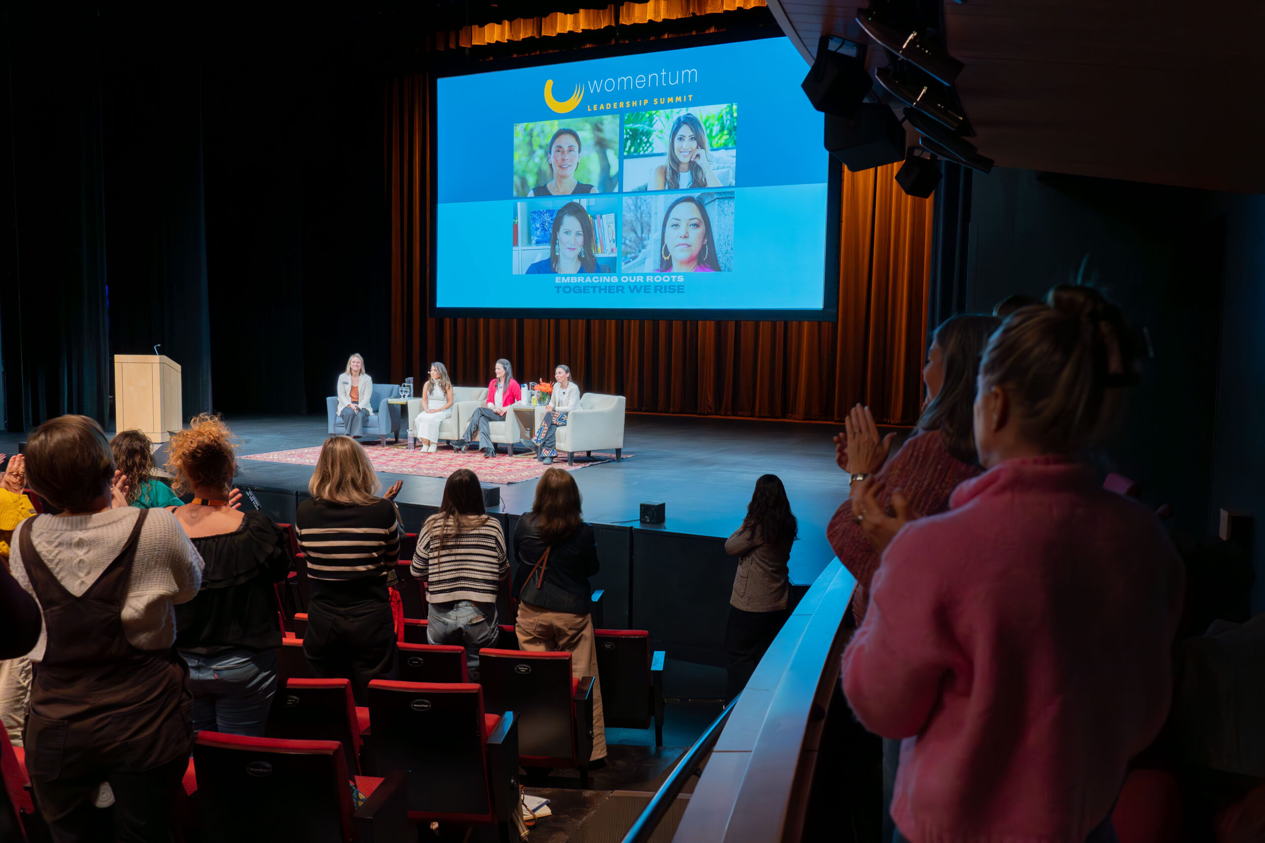 2024 Womentum Leadership Summit panel with crowd